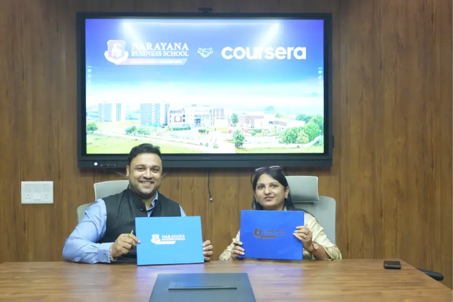Narayana Business School Partners with Coursera 1 MoU signing between NBS Ahmedabad and Coursera